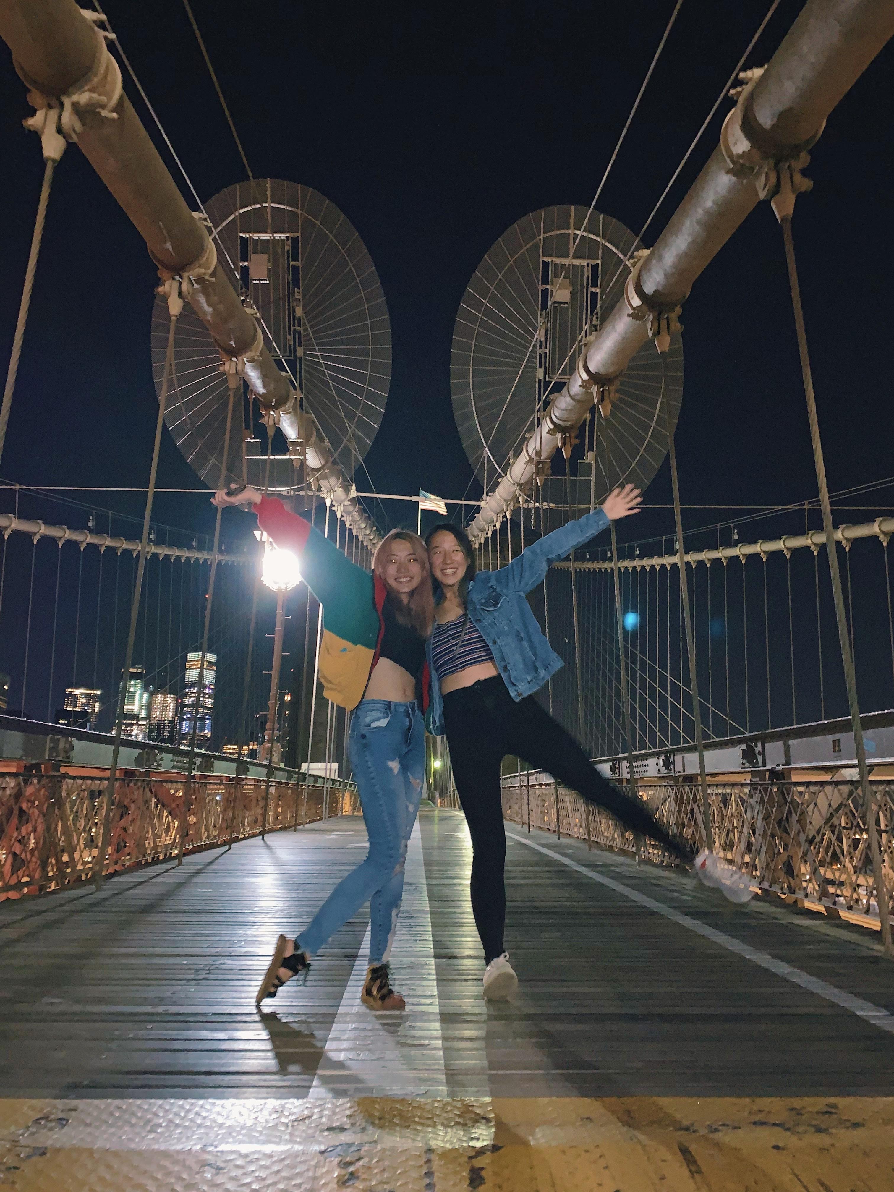 Me and my friend Ally on the Brooklyn Bridge at night!